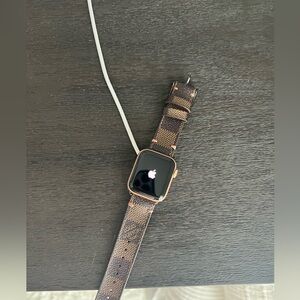 Gently used Apple Watch SE Generation 1 - rose gold. Comes with LV band